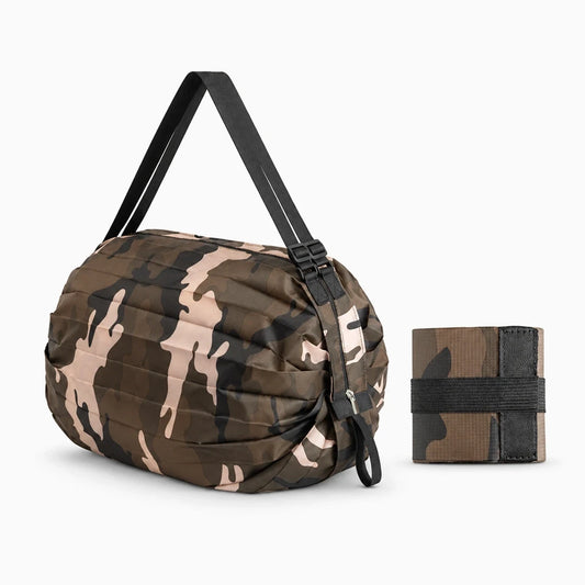 Détail des poignées renforcées d'un sac pliable pour les courses en nylon résistant