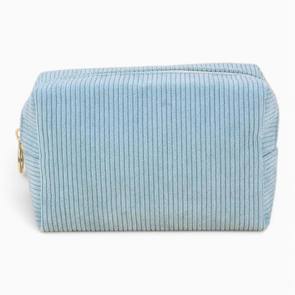 Grande trousse de toilette femme disponible en teintes variées, aspect velouté chaleureux