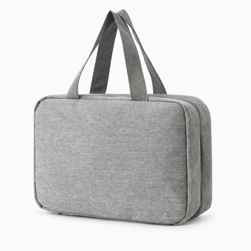 Trousse de toilette homme rose pliée compacte prête pour voyage en valise