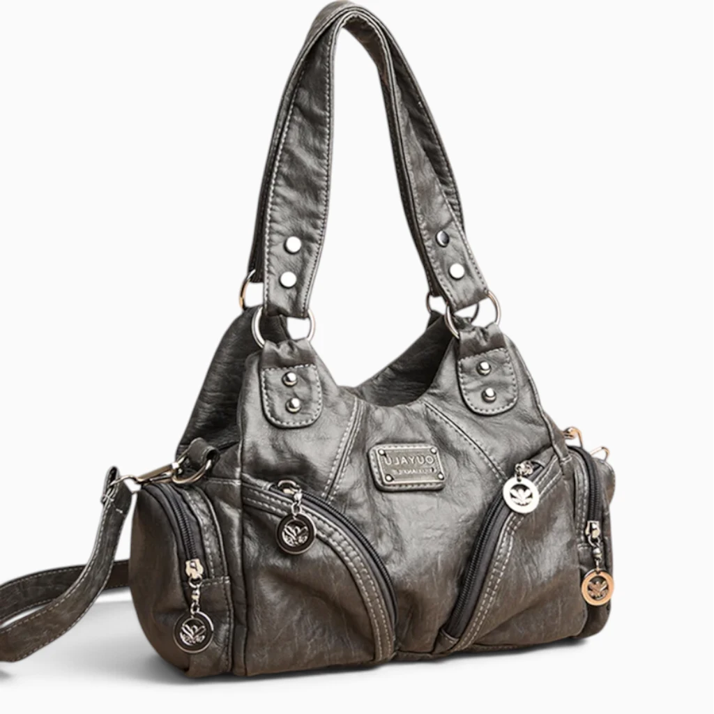 Sac à main noir petit format ouvert, intérieur spacieux et organisé