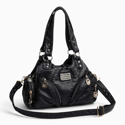 Petit sac à main noir porté en bandoulière, allure quotidienne élégante
