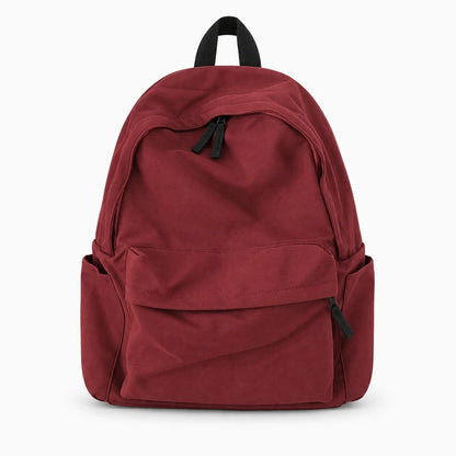 Détail de la toile et de la bandoulière ajustable du sac à dos 15l