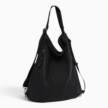 Vue de face du sac à dos ville ultra léger femme noir avec bandoulière ajustable