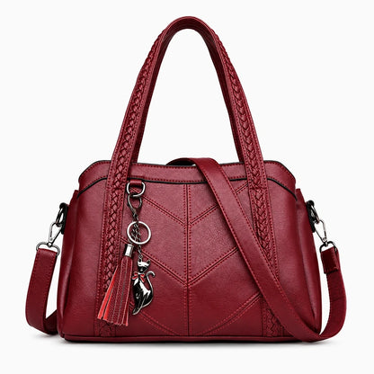 Cabas sac à main femme de forme structurée, coloris noir, porté à l'épaule