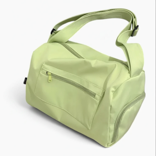 Sac à main vert avec bandoulière, silhouette spacieuse pour le quotidien