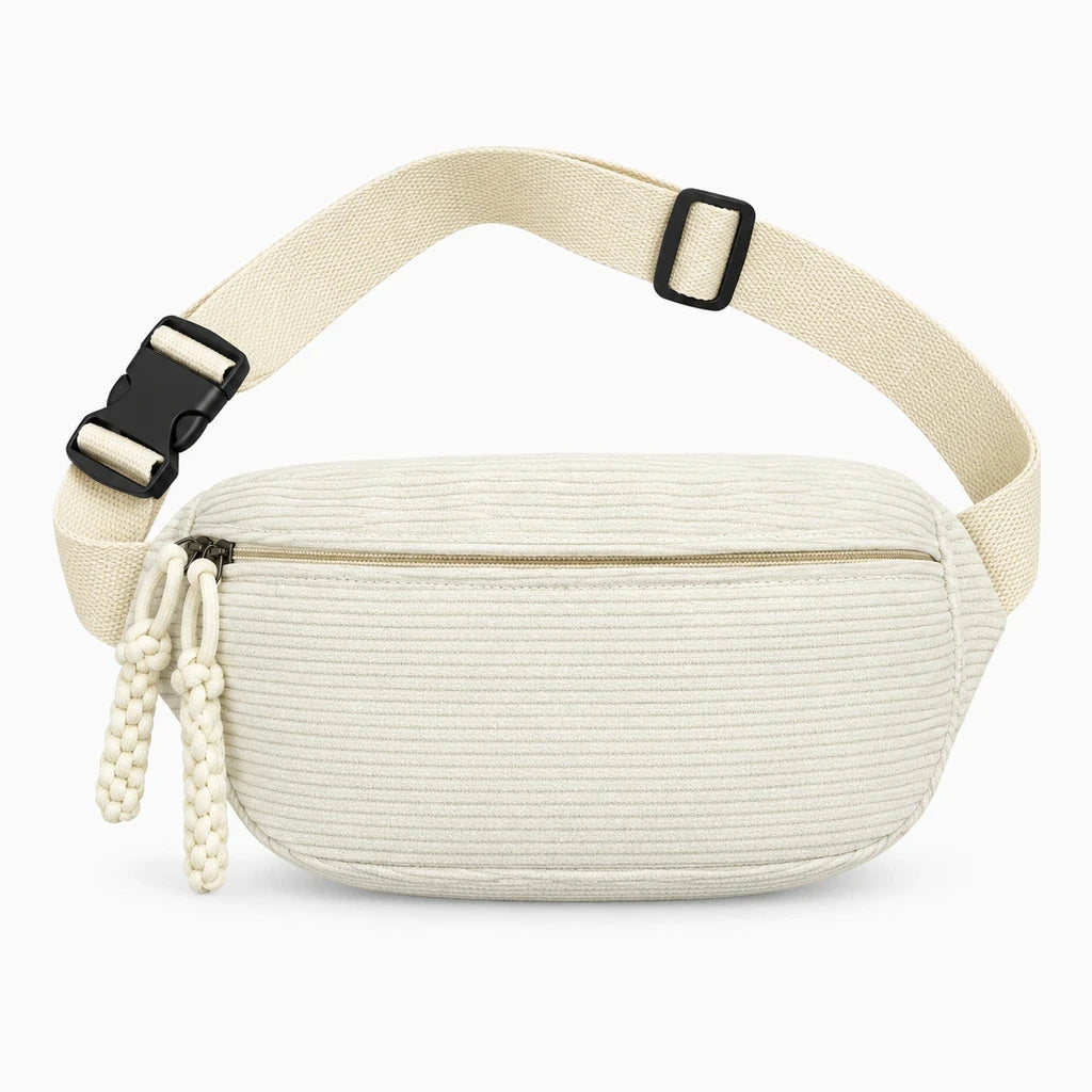 Détail de la texture velours côtelé du sac banane marron avec fermeture pratique